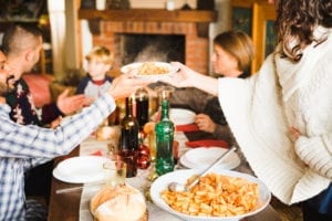 family eating around the dinner table on vacation