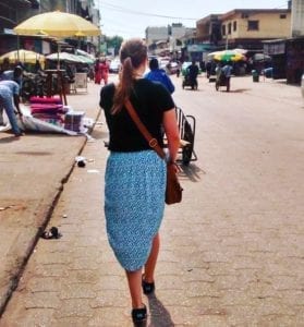 American travel nurse journeying to the local market in Africa