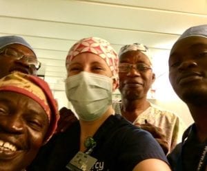 travel nurses and surgeons from benin in scrubs caps and masks