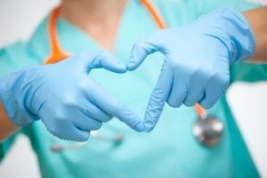 Nurse making heart shape with hands