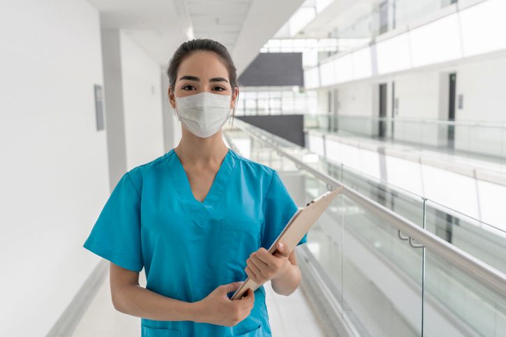 Happy nurse working at the hospital