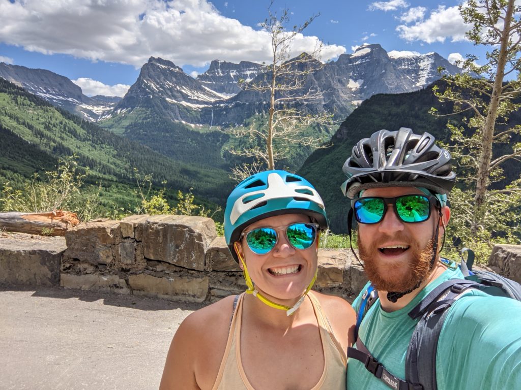man and woman biking in the mountains
