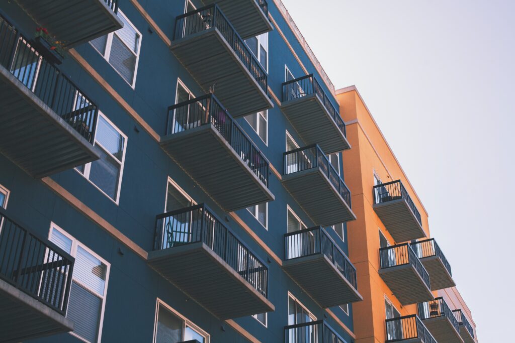 low angle view of blue and orange apartments