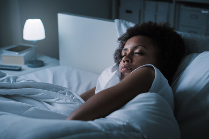 Woman sleeping in her bed