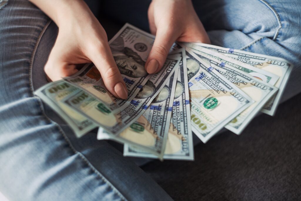 Girl holding American money