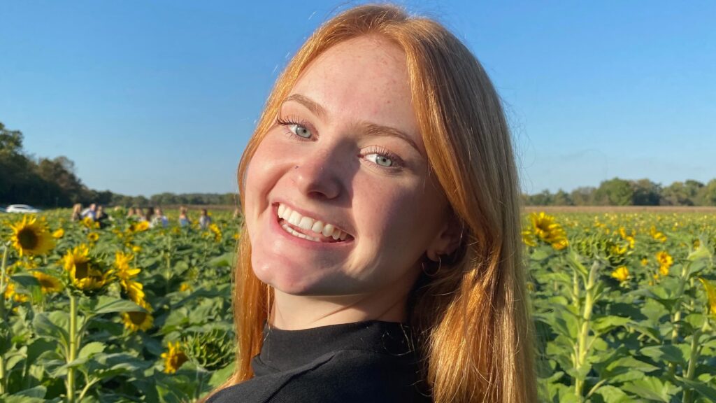 Kaylee in a sunflower field