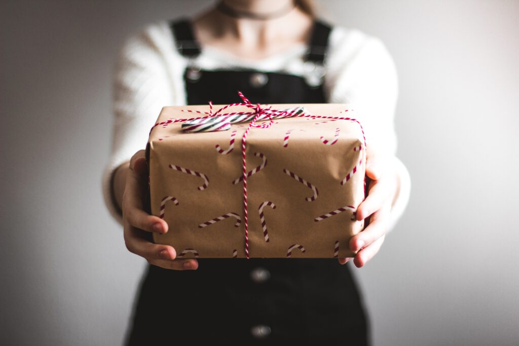 woman holding wrapped present