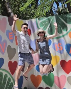 TNAA ambassadors jumping in front of a mural